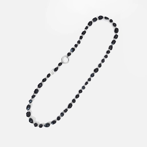 Detail of ethnic style black irregular faux turquoise beads with silver metal rings