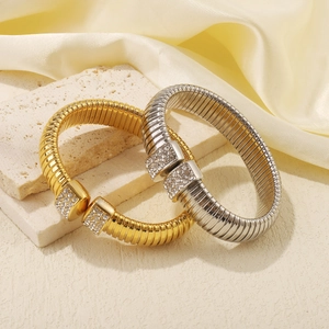 Polished gold and silver stainless steel snake bone bracelets with sparkling rhinestones