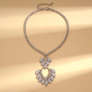 Close-up of a luxury silver drop pendant necklace with sparkling zircon and lobster clasp