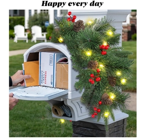 Christmas pine needle mailbox swag with warm LED lights, red berries and pinecones