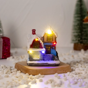 Glow-in-the-dark Christmas snow house with multi-colored LED lights and snowy roof