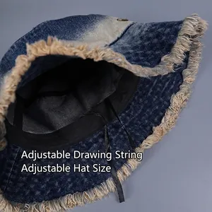 Gradient denim bucket hat with fringe edges and adjustable inner strap for custom fit