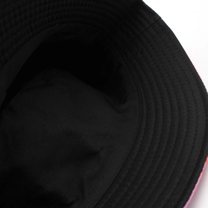 Double-sided black cotton bucket hat with premium stitching details and sun protection
