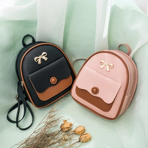 Mini PU leather backpack for women with golden bow and contrast colors in black and pink
