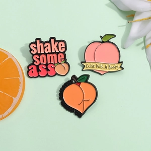 Peach shaped enamel pins with shake some ass lettering for scarves and clothes
