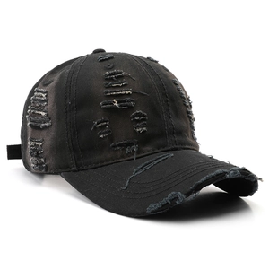 Retro distressed black washed cotton baseball cap with torn details and adjustable strap