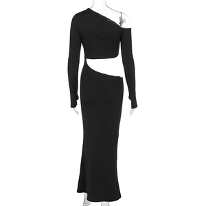 Detail of the side cutout and asymmetrical shoulder design on black slim fit dress