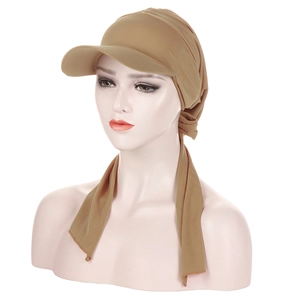 Detail of khaki pleated turban hat with visor and adjustable long tie ribbons
