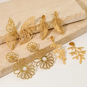 Set of 4 gold stainless steel earrings with cutout leaf, butterfly, and flower designs