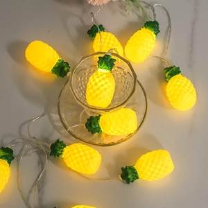Warm white LED pineapple string lights on marble table for room decor and parties