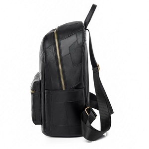 Sleek black leather backpack with gold hardware and side stitching for women's daily commute