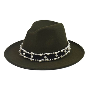 Detailed macro view of olive green fedora hat with faux pearl and black ribbon trim