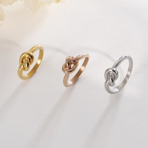 Minimalist knot design rings in gold, rose gold, and silver finishes for women