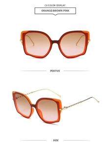 Front and side view of orange cat eye sunglasses with twisted gold metal temples