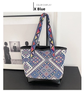 Close-up of ethnic geometric woven tote bag in blue with premium leather trim and strap