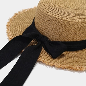 Women's summer raffia sun hat with a black bow ribbon and stylish frayed edge brim