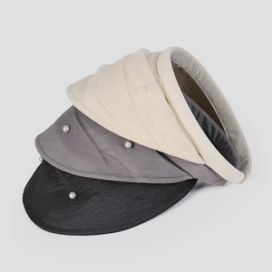 Three elegant mesh sun visors with pearl accents in beige, gray, and black colors