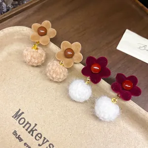 Flocked flower earrings with plush fur balls and pearls in brown and deep red colors