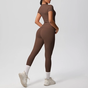 Detail view of high-waist slimming yoga leggings and short sleeve top in dark brown