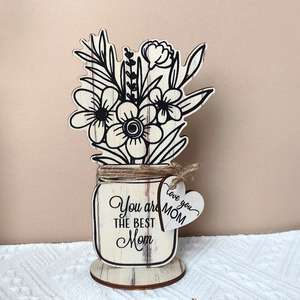 Detail of wooden flower vase ornament with You are THE BEST Mom engraving for Mother's Day