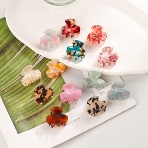 Variety set of 13 colorful mini acetate hair claws with marble and floral patterns