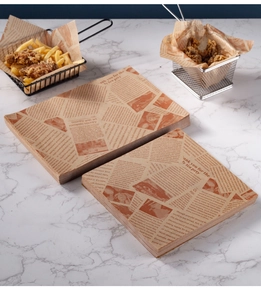 Detail showing newspaper print greaseproof paper for fried chicken and burger wrapping