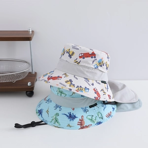Detail of kids sun hats with car and dinosaur prints featuring neck flaps and windproof ropes