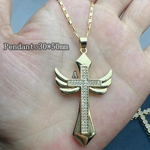 Golden wing cross pendant necklace for women with white zircons on a delicate link chain