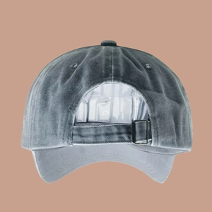 Rear view of grey washed cotton baseball cap featuring adjustable strap and metal buckle