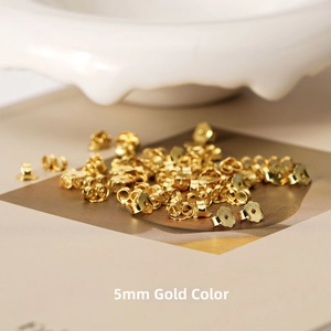Macro shot of S925 sterling silver earring backs with 18K gold plating and 5mm engraving