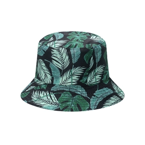 Black bucket hat with tropical green leaf pattern, ideal for summer beach sun protection