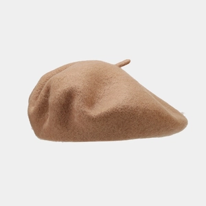 Detail of high-quality wool beret in light brown showing premium fiber texture