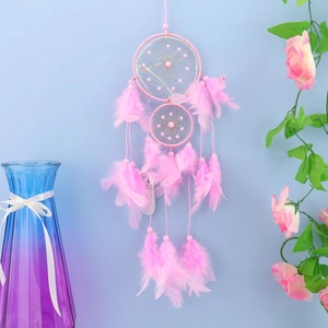 Pink dream catcher wall hanging with delicate feathers and hand-woven beads decor