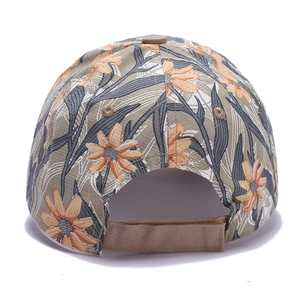Close-up of the adjustable back strap and floral print on a cotton baseball cap