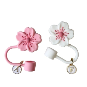 Pink and white cherry blossom straw toppers for Stanley cup with letter pendants A and F