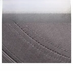 Close-up of grey twill cotton fabric with durable double-row stitching on the flat top cap