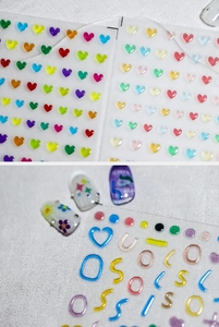 Detailed view of 3D embossed jelly nail art stickers featuring colorful hearts and shapes