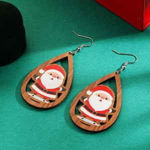 Detail of tear-drop wooden Christmas earrings with Santa Claus pattern and gift box
