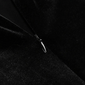 Detailed macro view of black velvet fabric texture and seamless invisible zipper design