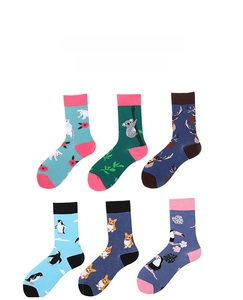 Detail view of cotton crew socks featuring various animal patterns like polar bears and koalas