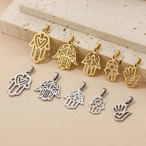 Detailed set of gold and silver stainless steel Hamsa Hand pendants with cutout designs