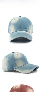 Detailed view of washed denim baseball caps in black, light blue, and dark blue colors