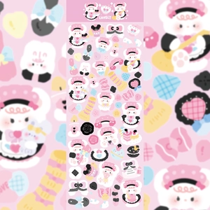 Detail of pink cartoon bear stickers with heart and cake patterns for DIY journals