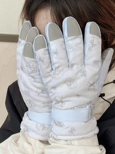 Detail of cute rabbit print ski gloves with adjustable wrist straps and reinforced fingertips