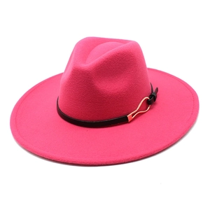 Detail of fuchsia wool fedora with black leather band and golden metal buckle decoration