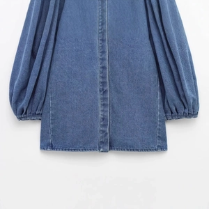 Blue denim shirt for women featuring puffy lantern sleeves and a classic lapel collar