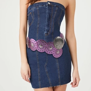 Detail of purple waist belt with silver metal discs on a denim dress
