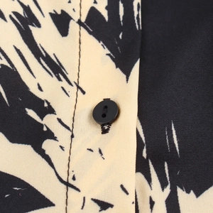 Women's autumn beige long dress with black abstract print and button closure detail