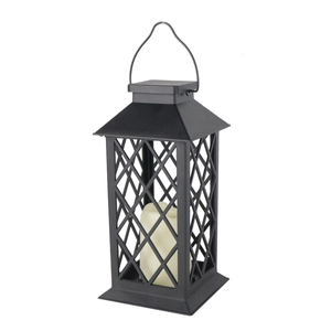 Detail of retro black metal lantern with warm led candle inside for cozy outdoor decor