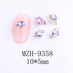 Detail of pink crystal heart nail charms with silver winged base and 10x5mm laser effect